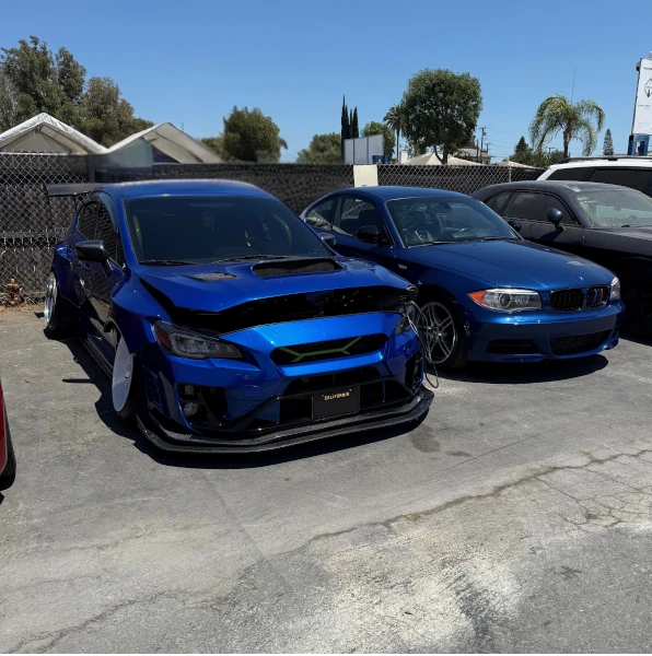 Custom blue paint of fully custom built subaru impreza wrx sti w carbon fiber hood and rear wing